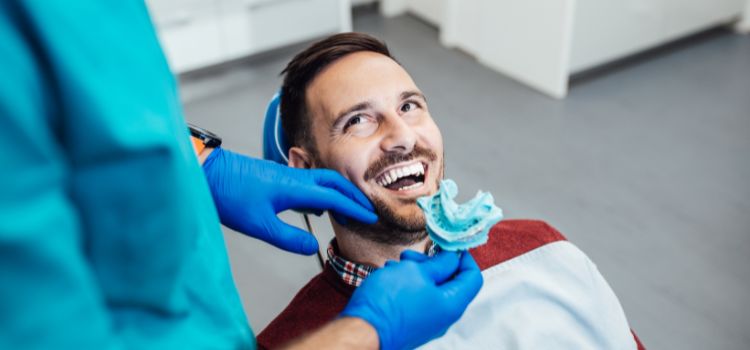 a-man-getting-his-teeth-impressions-by-a-dentist..jpg